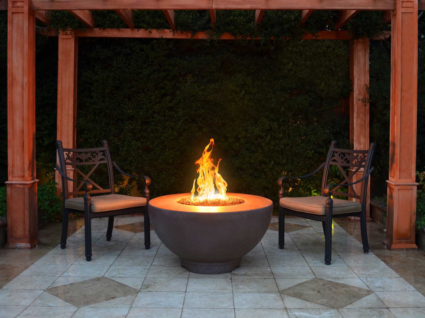 The Outdoor Plus Sienna fire pit in an outdoor living space